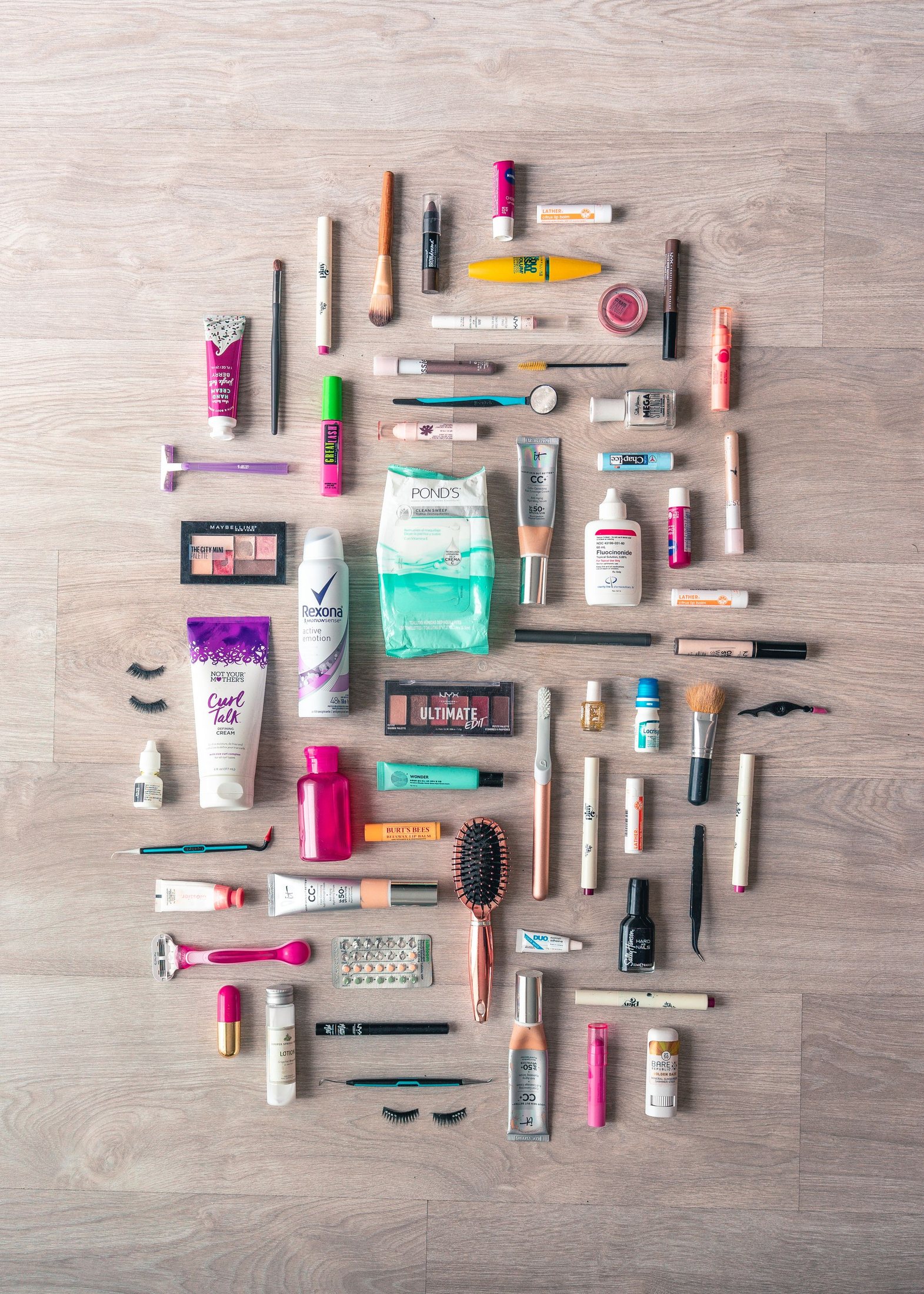 Beauty and grooming products arranged neatly on a wooden surface